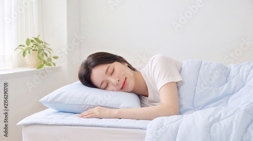 하늘색 베개를 베고 잠든 여성 · Woman Sleeping Peacefully on Light Blue Pillow