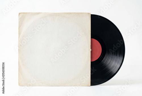 Classic black vinyl record partially slid out of a plain aged white paper sleeve
