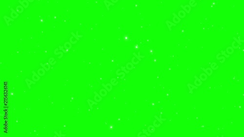 Dust particles float across a bright green screen background.