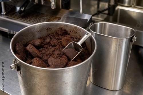 Used Coffee Grounds Collected for Recycling in Cafe