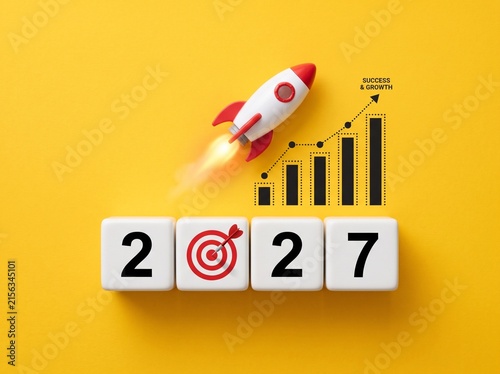 Business Growth Concept for 2027 with Rocket Launching Over Increasing Bar Chart and Target Icon on White Blocks