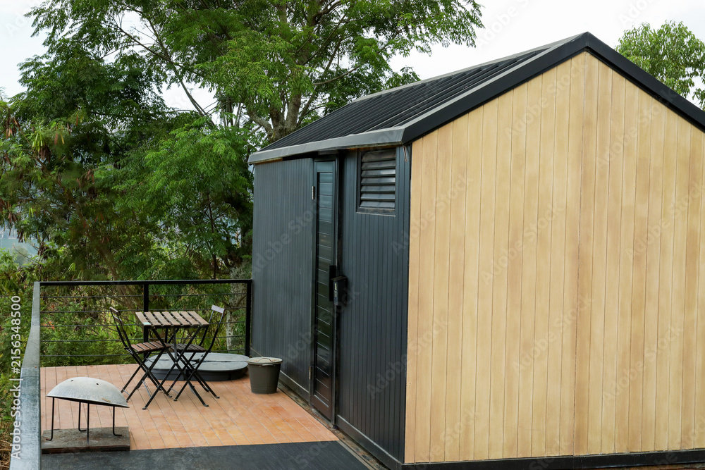 Fototapeta premium Cozy cabin in greenery for a peaceful getaway