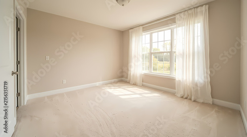 Bright empty bedroom with neutral walls and plush carpet