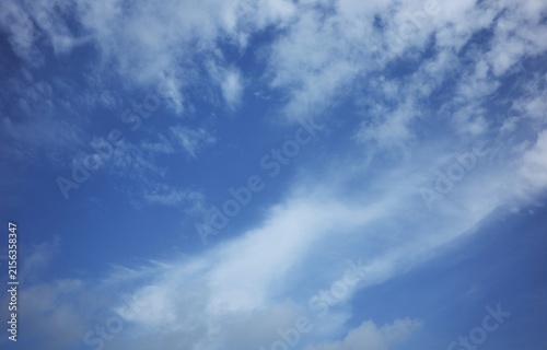 Photography The sky was clear blue, with sparse white clouds scattered throughout