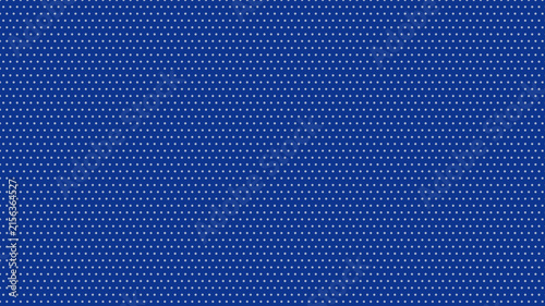 Fotografie Classic blue background with small white dots creating a regular geometric polka