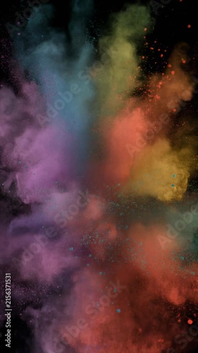 Slow-motion shot of colorful powder bursting in the air, forming intricate clouds and swirls 