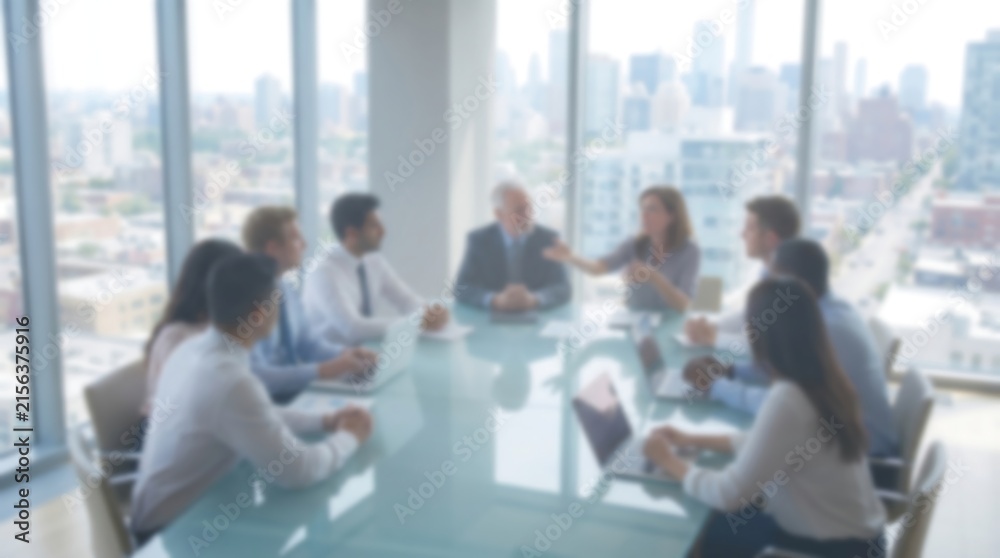 Fototapeta premium Blurred business meeting in conference room with team of professionals sitting around table during presentation with city skyline view through large windows for corporate success theme