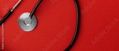 Stethoscope on Red Background with Copy Space