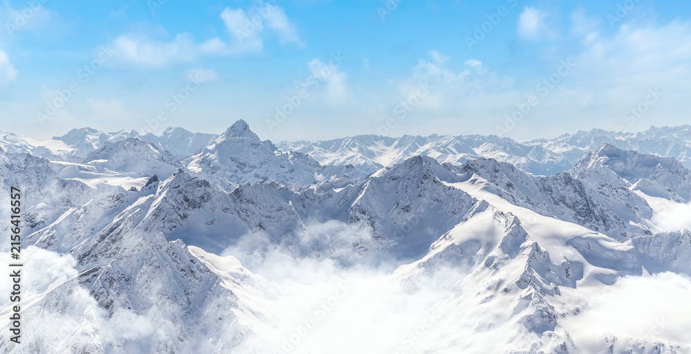 Fototapeta premium Panorama of winter mountains with blue sky in Caucasus region,Elbrus mountain, Russia