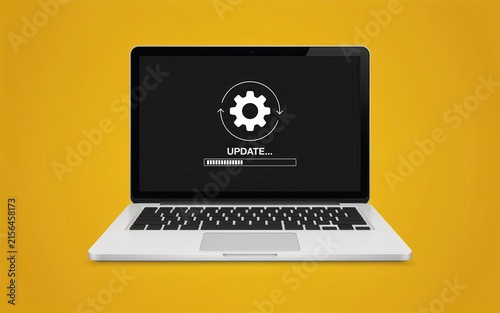 Obraz na płótnie Laptop computer updating software process bar on yellow background. Software installation and system upgrade concept.