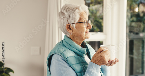 Принти на полотні Senior, woman and thinking by window with tea, remember past history and daydream in retirement home
