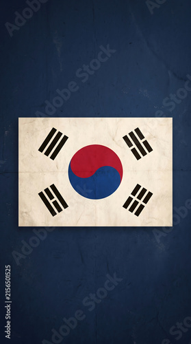 Vintage grunge South Korea flag on dark background, retro paper texture with Taegeuk symbol and trigrams, souvenir style design for copy space