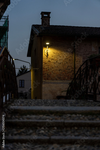 Stone Stairway and Rustic House Illuminated at Dusk in Italy