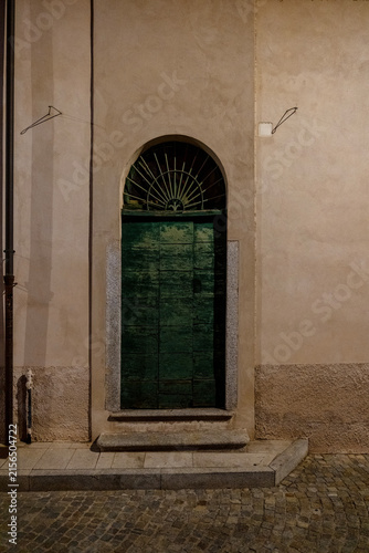 Old Green Arched Door on a Historic Italian Building