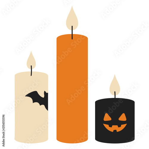 Three Halloween candles with spooky motifs during a festive celebration Isolated on white background
