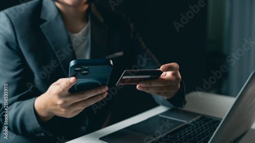 Foto Business person using mobile phone and credit card for online payment or digital