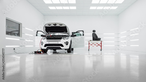 Obraz na plátně white SUV in modern auto detailing studio workshop