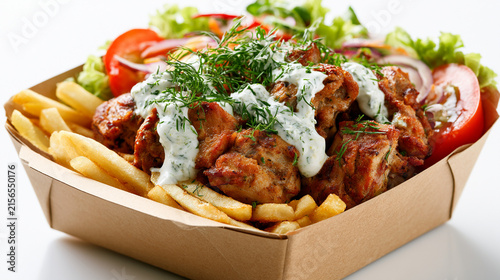 Grilled chicken souvlaki with french fries and tzatziki