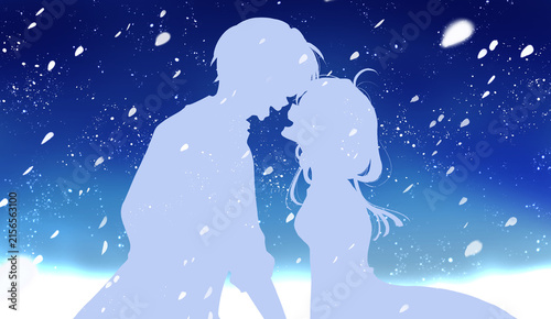 花吹雪の中幸せそうに向かい合う男女　夜空　シルエット