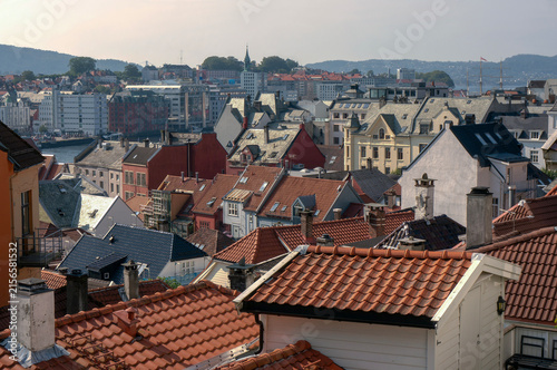 Cityscape, rooftops, tiled roofs, approaching sunset. Bergen, Norway.