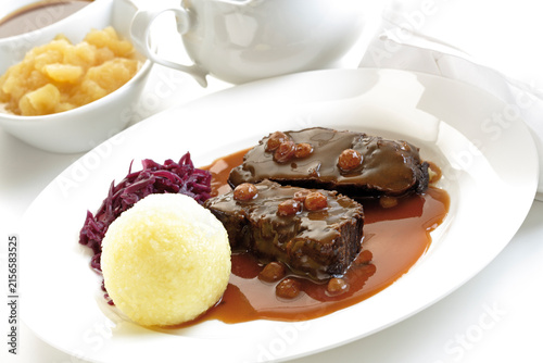 Germany, Rheinland, Roasted beef with dumplings on plate, close-up