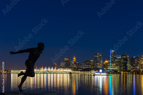 Canada, Vancouver, Harry Jerome statue and skyline at night
