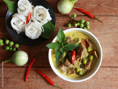 Beef green curry with eggplant, chili and basil serve with rice noodle. Authentic Thai food.