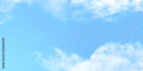 Obraz na plátně Soft light blue sky background with subtle white clouds