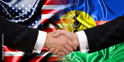 Handshake between the United States and New Caledonia, international friendship, background with flags. Flags.