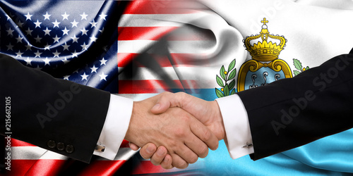 Handshake between the United States and San Marino, international friendship, background with flags. Flags.