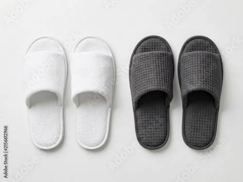 Pair of white and dark gray waffle slippers side by side for comfort