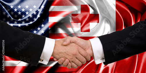 Handshake between the United States and Tonga, international friendship, background with flags. Flags.