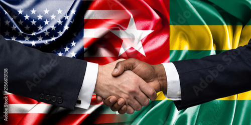 Handshake between the United States and Togo, international friendship, background with flags. Flags.