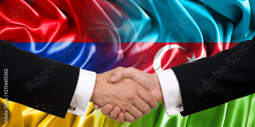 Handshake between Armenia and Azerbaijan, international friendship, background with flags. Flags.