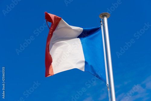 Flying national flag of European country o France at quayside of French city of Le Havre on a sunny summer day.. Photo taken July 14th, 2026, Le Havre, Normandie, France.