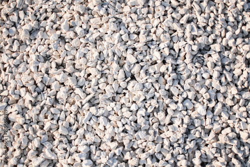 Large pile of crushed limestone gravel, a versatile construction material used for road bases