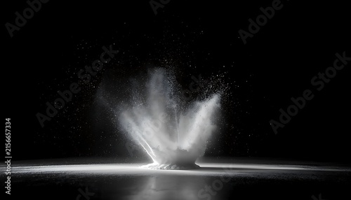 Powerful vertical explosion of white powder on black surface with explosion