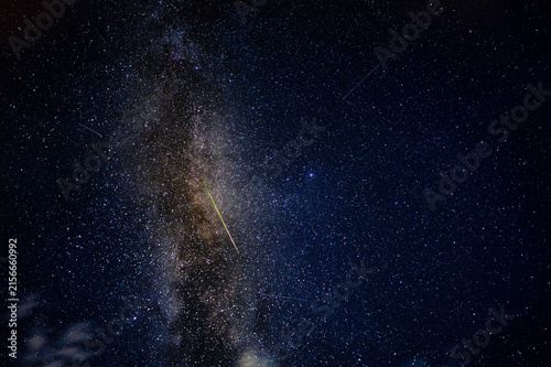 Obraz na płótnie Milky Way galactic core with a bright green meteor, deep sky astrophotography