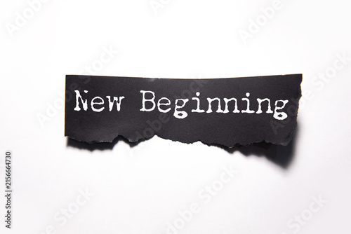 Фотография New Beginning text on paper
