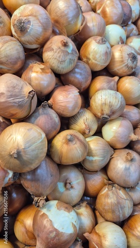Fresh Organic Brown Onions Piled High in a Market for Healthy Cooking and Culinary Ingredient Concepts