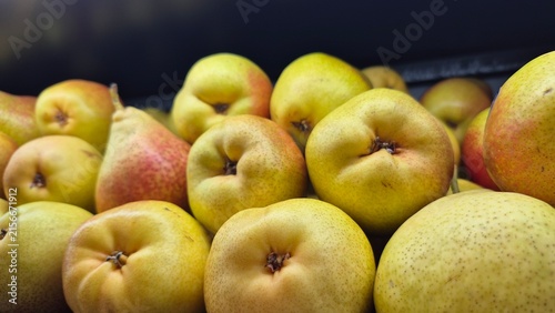 Freshly Harvested Organic Pears Displayed for Sale in a Market, Perfect for Healthy Eating and Food Photography