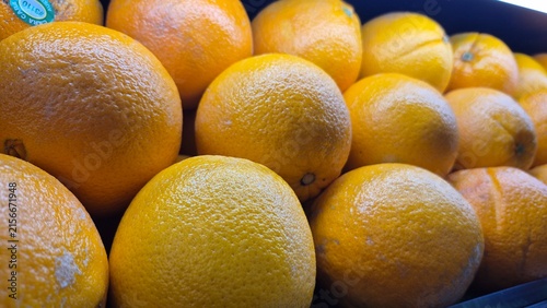 Vibrant Fresh Oranges Displayed in a Market Stall for Healthy Eating and Vitamin C Content