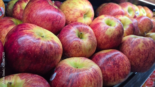Vibrant Red and Yellow Apples Displayed in a Grocery Store Produce Section for Healthy Eating Concepts