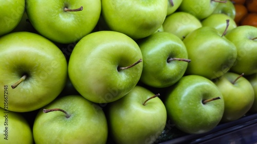 Vibrant Green Apples Displayed for Sale at a Grocery Store or Farmers Market for Healthy Eating Concepts