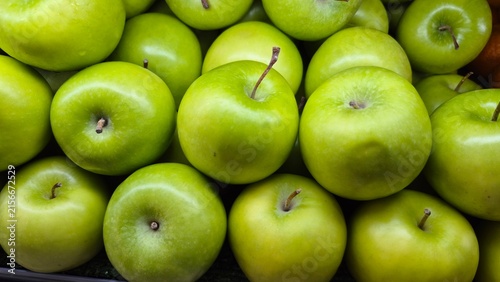 Close-up View of Freshly Picked Green Apples Piled Together for Healthy Eating and Grocery Store Produce Displays