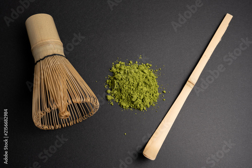Japanese matcha tea powder with traditional bamboo utensils