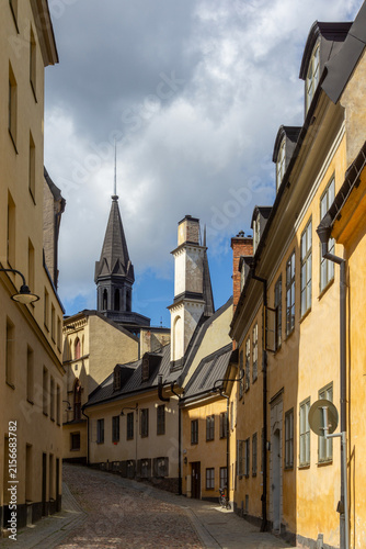 Sticker Södermalm cobblestone street with historic architecture in Stockholm