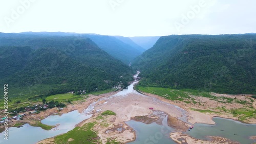 Aerial view of scenic mountain river flowing through khasi hills in Bichanakandi, Sylhet, Bangladesh.