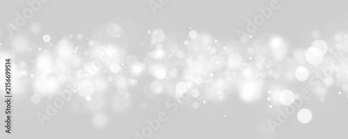 Bild auf Leinwand Soft monochrome bokeh lights scattered densely across a dark background in varyi