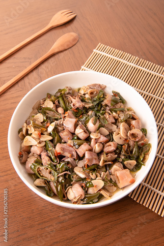 Obraz na plátně Cumi sambal ijo, or salted squid stir-fried with chopped green chilies and garlic, is a popular home-cooked seafood dish in Indonesia
